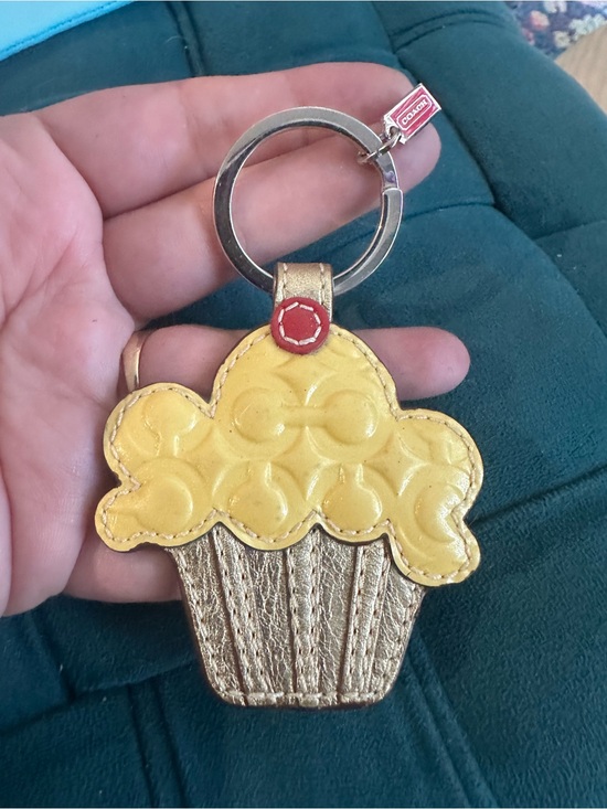 Coach Accessories - Coach Metallic Gold Cupcake Key Fob with Red Tag